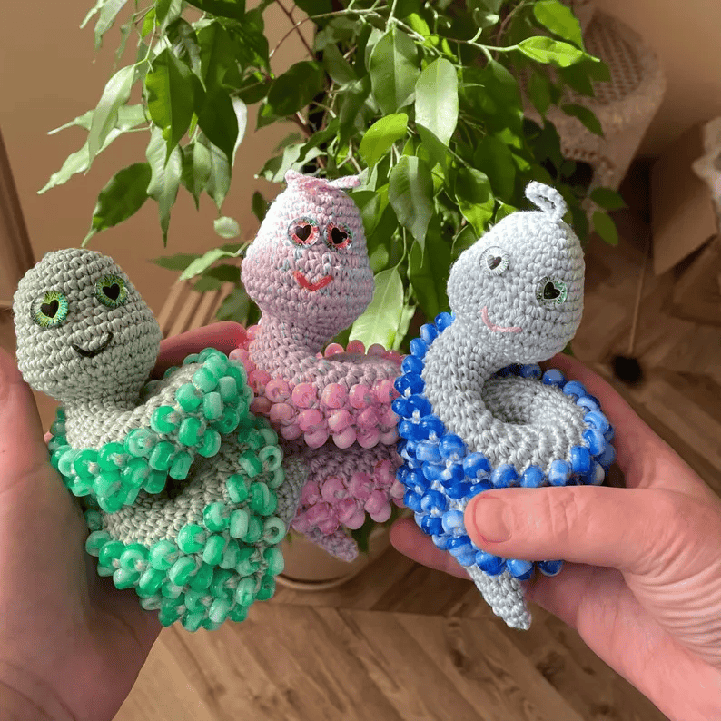 Three colorful sensory snails